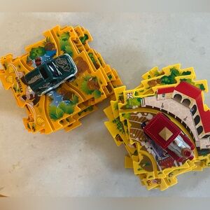 Two puzzle track play sets: Zoo/ safari and Train station